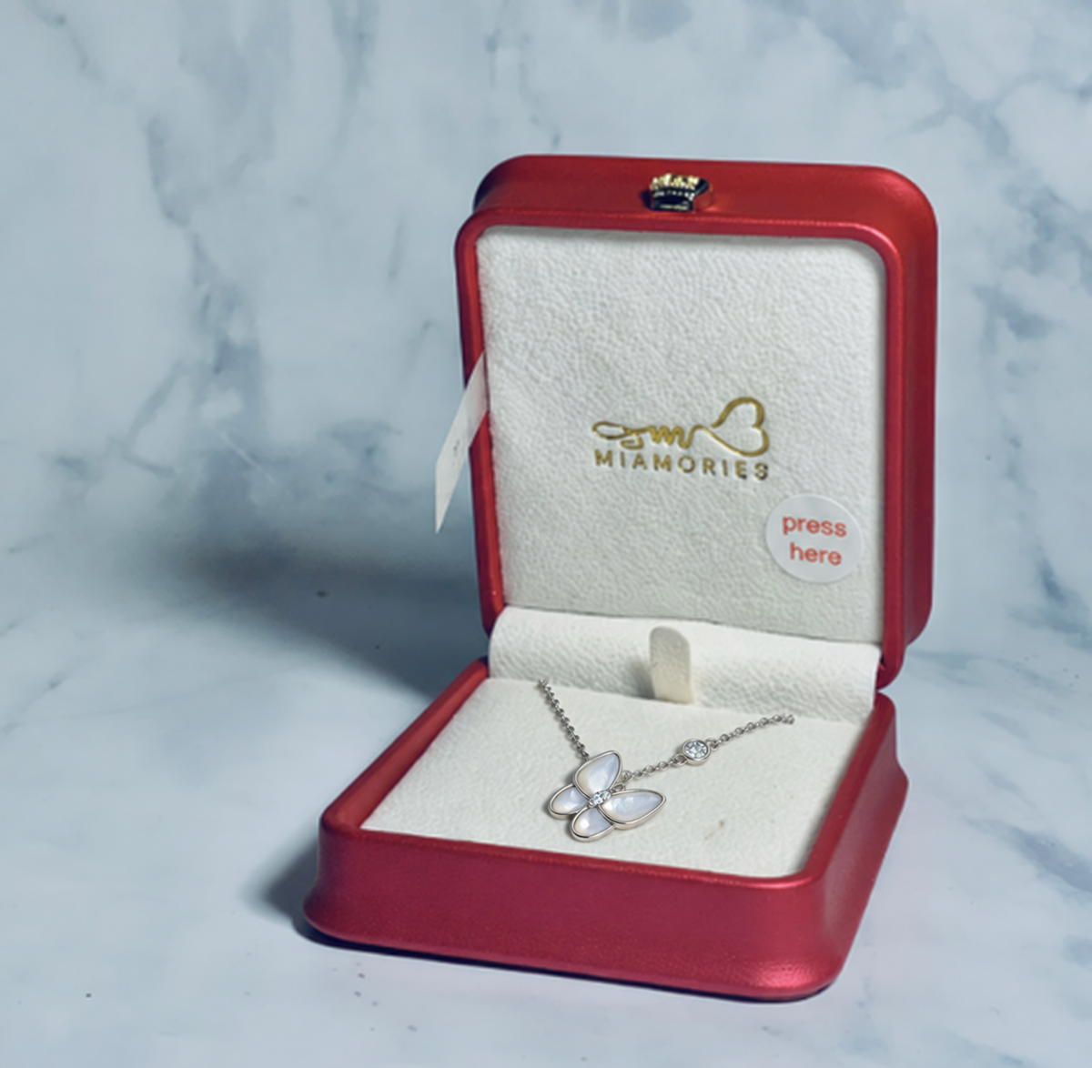 Mariposa butterfly necklace inside the red Miamories voice recording gift box