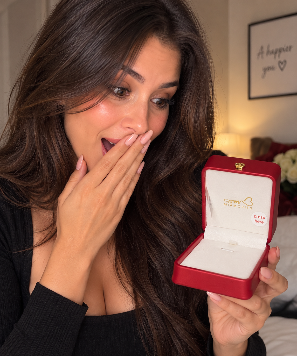 Surprised woman holding open Miamories voice recording gift box